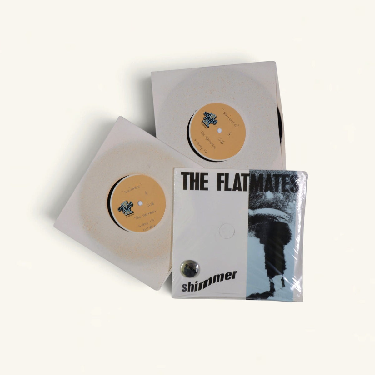 The Flatmates - ‘Shimmer’ 7-Inch Acetates x2 (Tape One) + Sealed ‘Shimmer’ 7-Inch with Badge