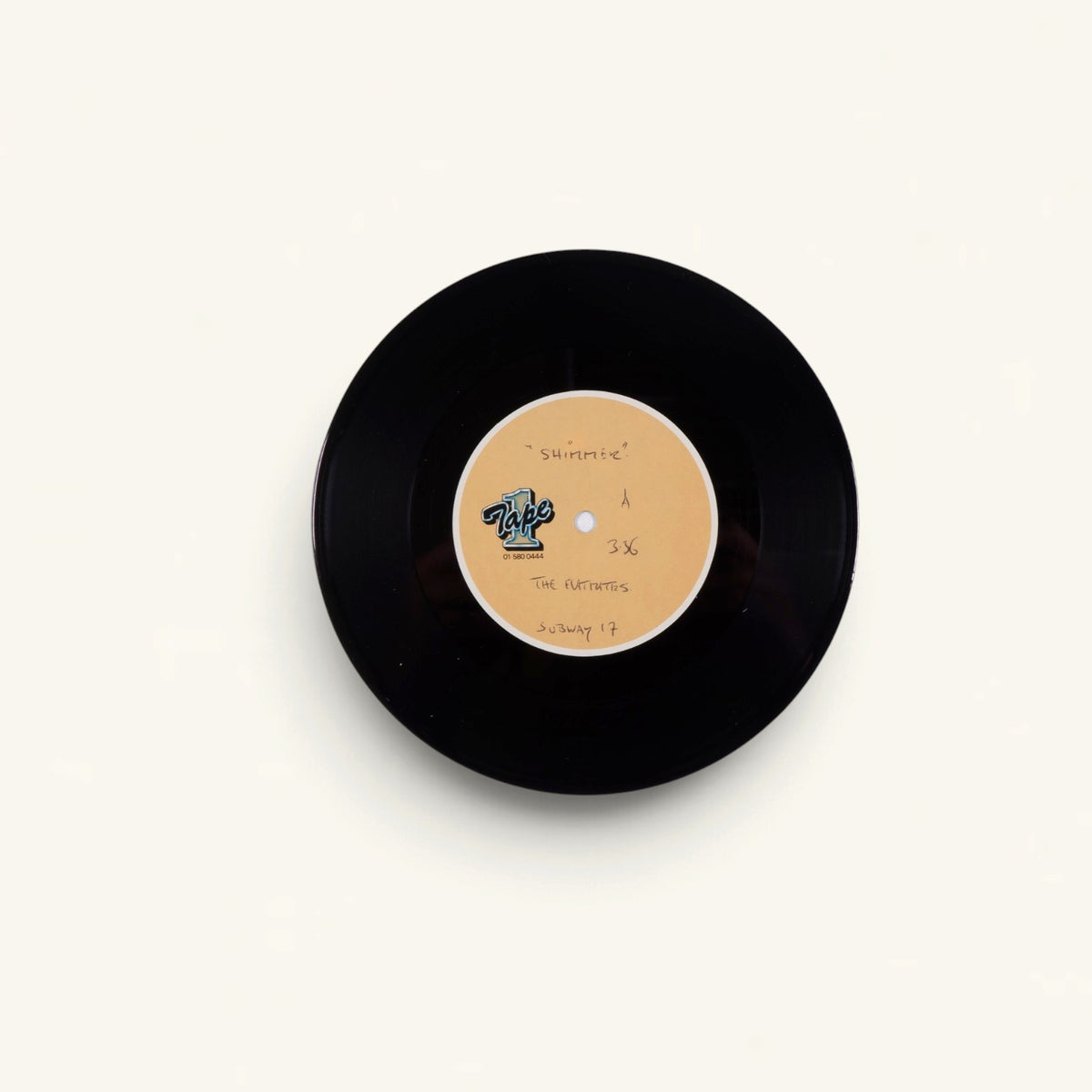 The Flatmates - ‘Shimmer’ 7-Inch Acetates x2 (Tape One) + Sealed ‘Shimmer’ 7-Inch with Badge