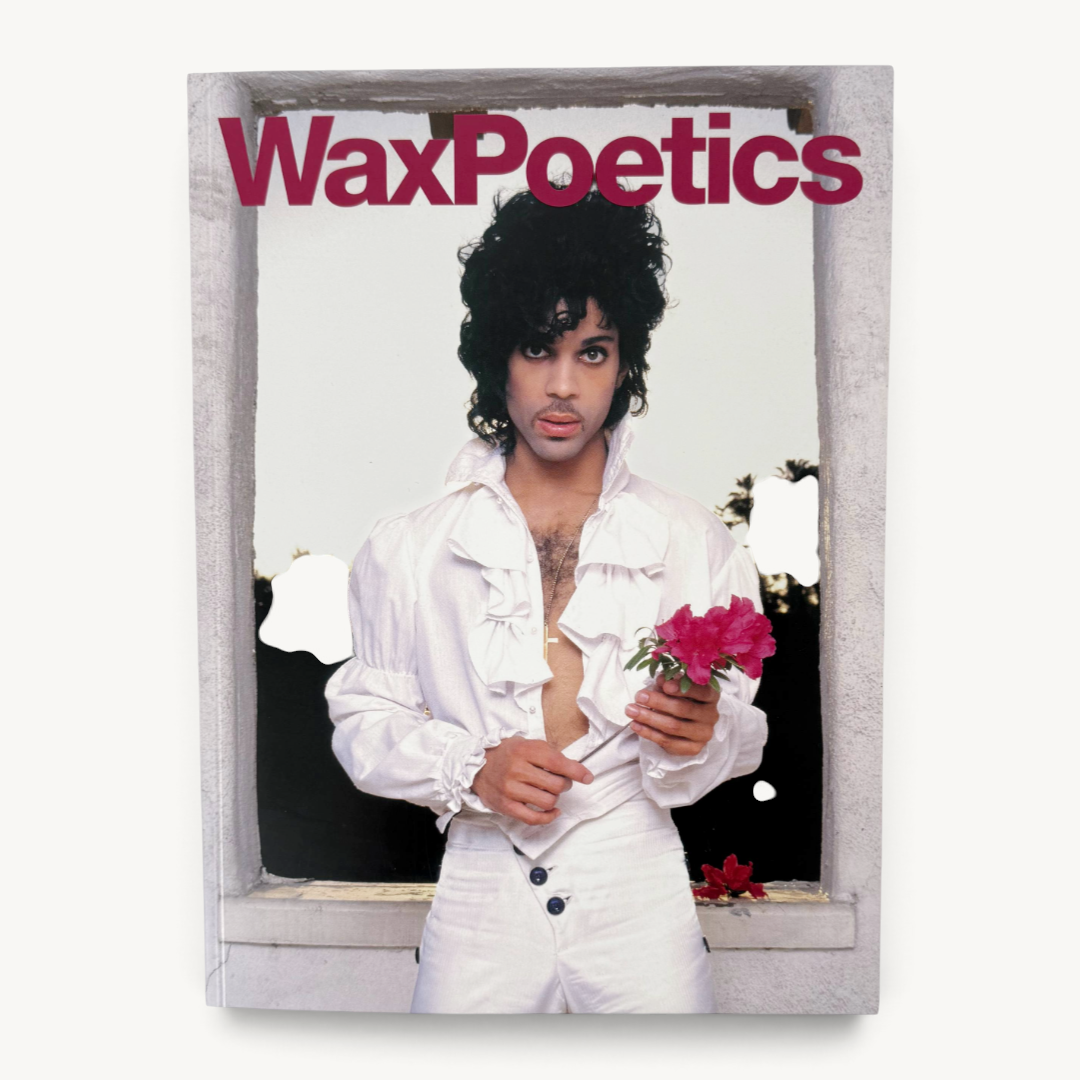 Wax Poetics magazine issue featuring Prince on the cover wearing a white ruffled shirt and holding a pink flower